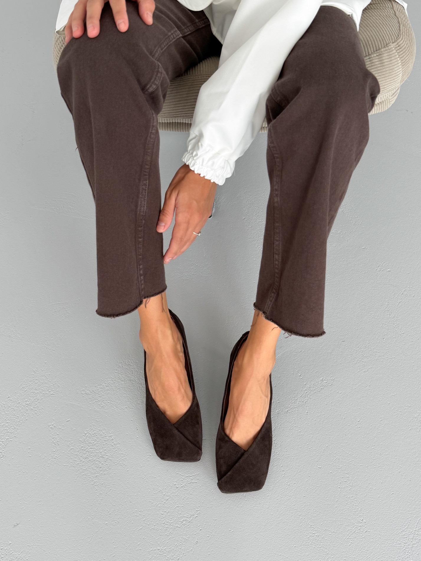Dark brown suede square-toe flats with a folded vamp