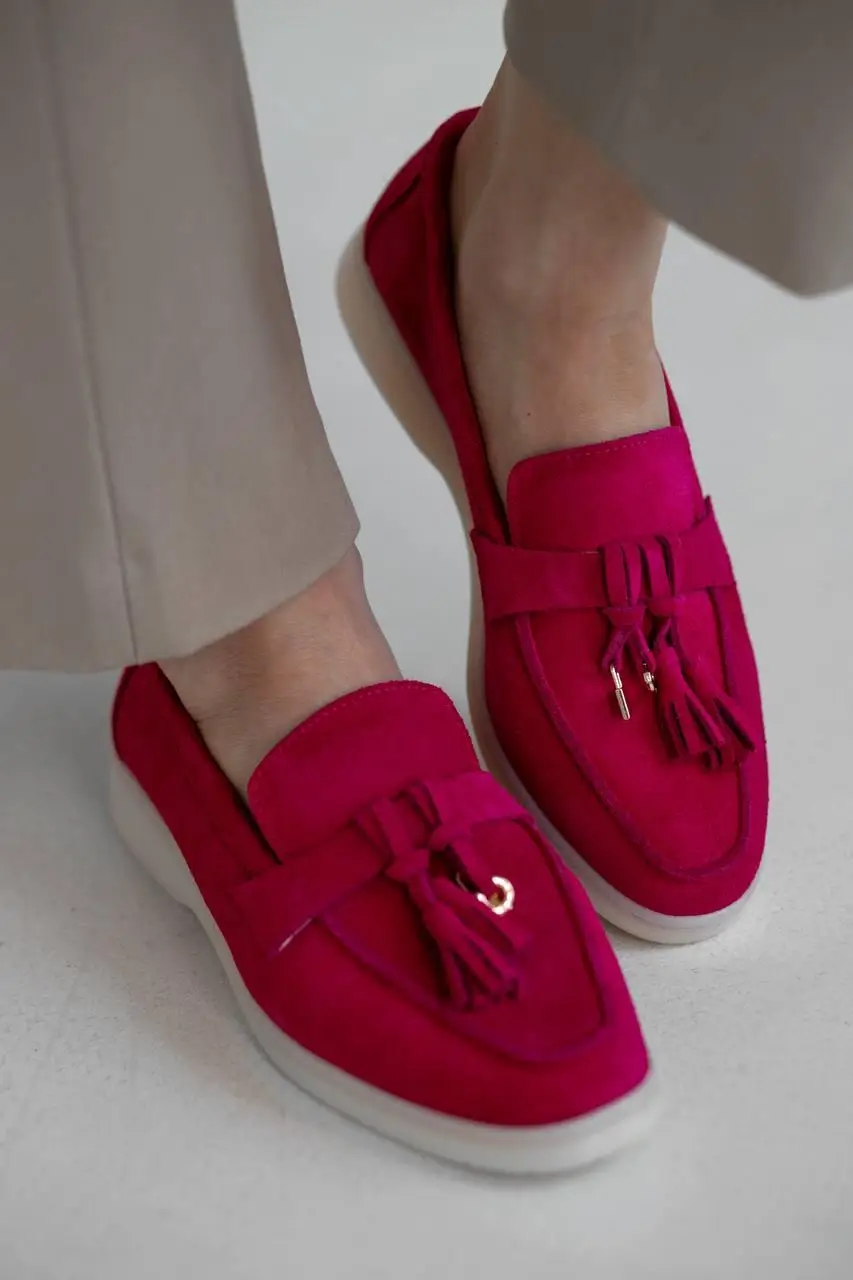 Fuchsia suede tassel loafers with a cream sole